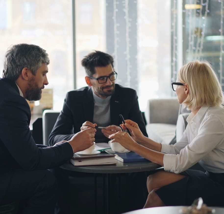 Tax and compliance professionals in a client consultation meeting
